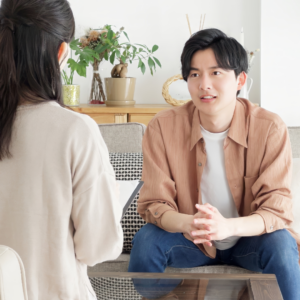 Man receiving counselling in a supportive conversation.